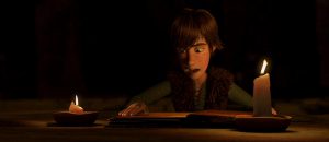 Hiccup reading the Dragon Manual