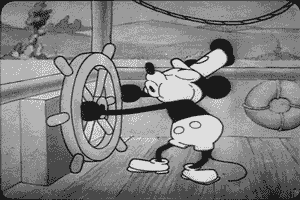 Mickey mouse whistling cheerfully on steamboat, scene from "Steamboat Willie" 1928 Disney
