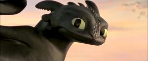 Toothless looking over his shoulder, before leaving forever