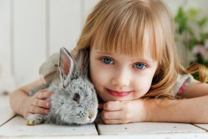 Girl holding bunny rabbit