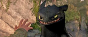 Hiccup reaching out to Toothless