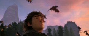 Hiccup watching the dragons fly away to the Hidden World