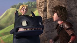 Kid pulling on Toothless's ears