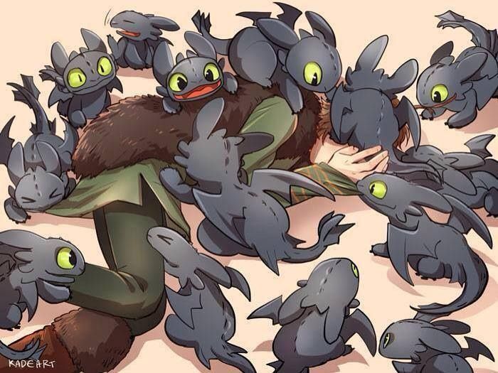 Hiccup being overpowered by many playful baby Night Furies.